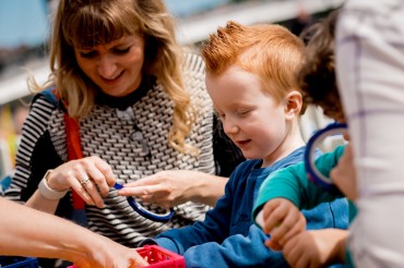 Adult and child crafting outside together