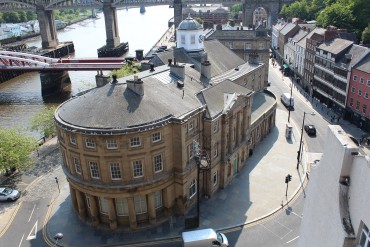 An aerial view of Newcastle upon Tyne’s Guildhall with views of the River Tyne’s bridges in the background